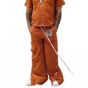 NEW SAINT VANITY nylon tearaway pants in dark orange